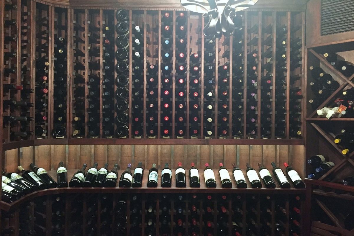 Elegant wine cellar showcasing numerous bottles arranged in wooden racks, ideal for any wine enthusiast.